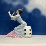 Handmade ceramic seated dancer