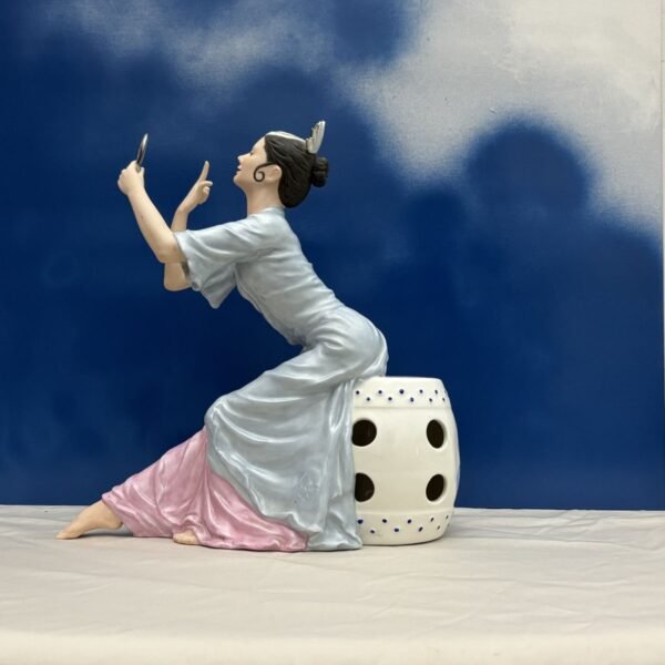 Handmade ceramic seated dancer