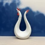 White ceramic paired crane sculpture